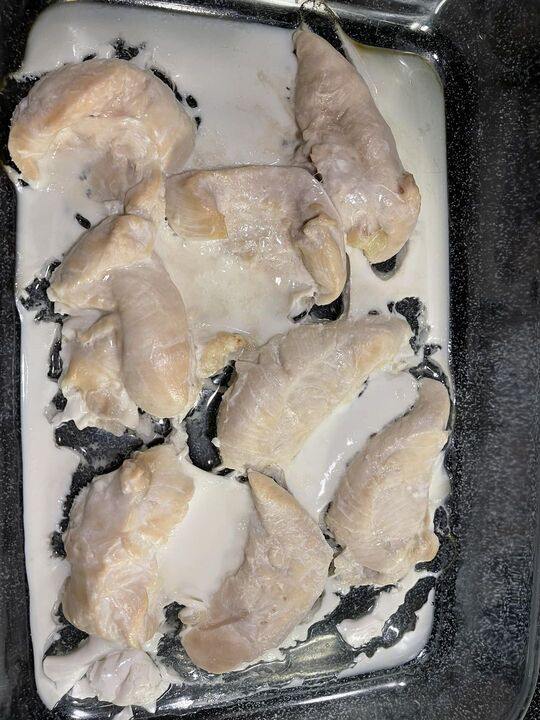 Why white residue sometimes appears on cooked chicken